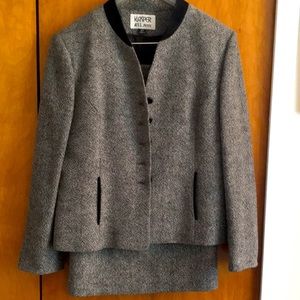 Two piece skirt suit.